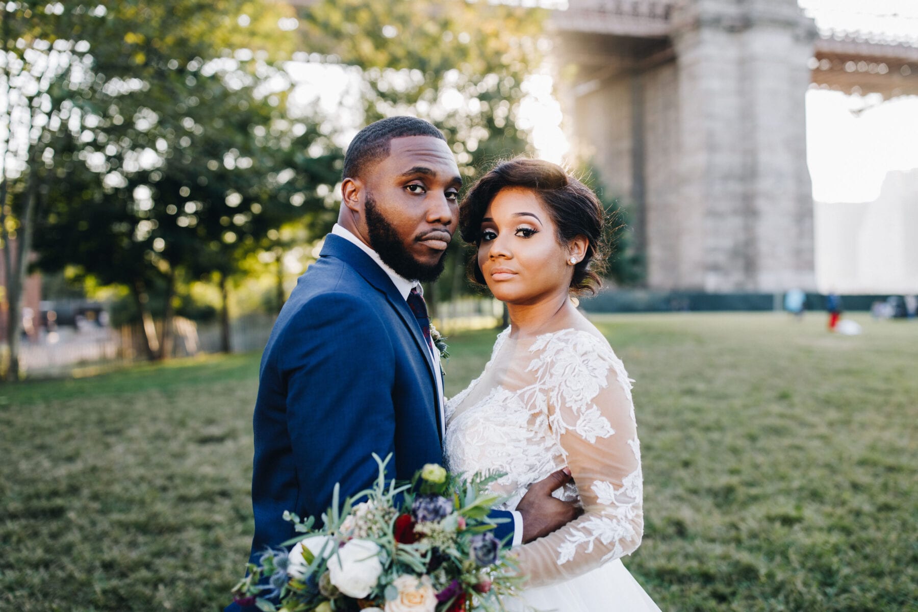 Bride and groom by Brooklyn Bridge