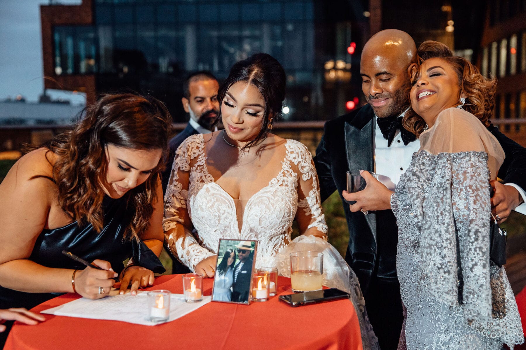 Bride and groom signing wedding certificate