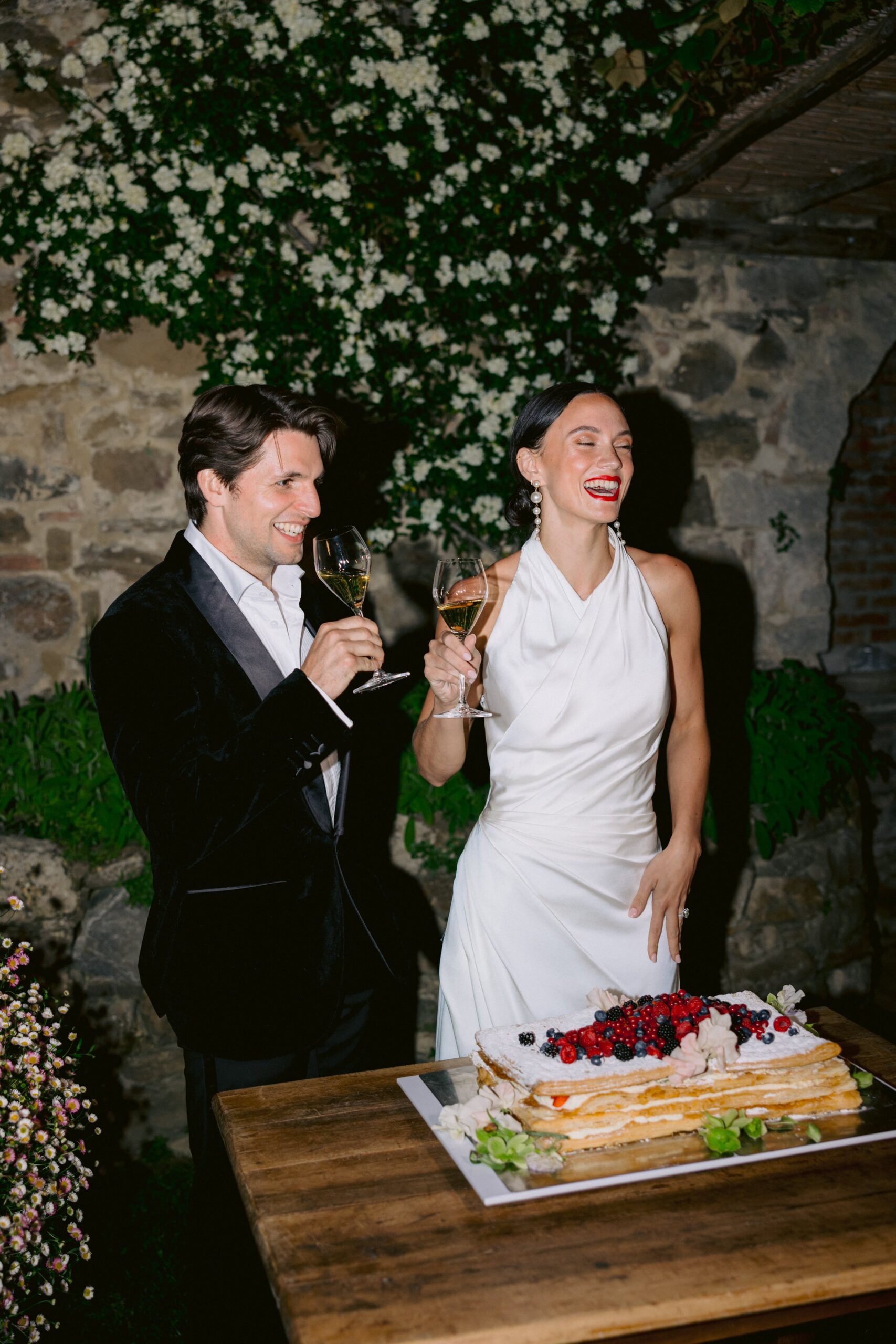 Bride and groom cutting cake in Italy