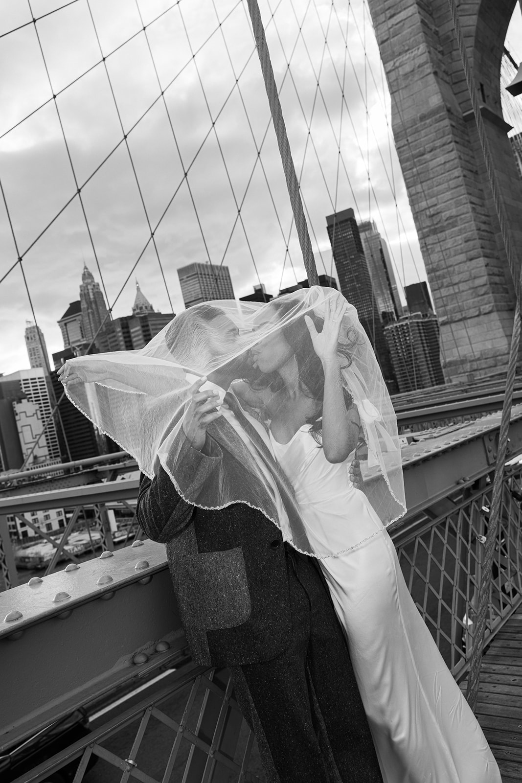 Fashion-forward bride and groom walk together downtown Manhattan on their City Hall NYC wedding day.
